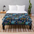 Alaskan musk ox inspired plush blanket in blue featuring a nature-inspired pattern