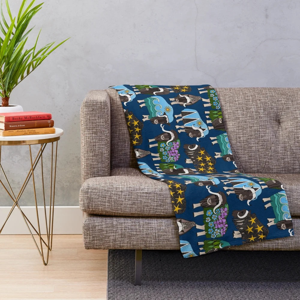 Alaskan musk ox inspired plush blanket in blue featuring a nature-inspired pattern
