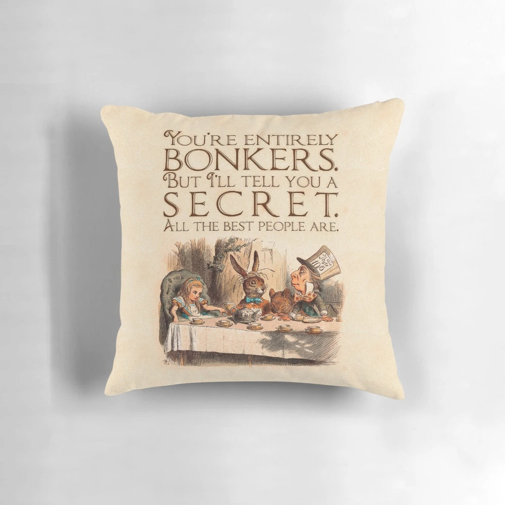 Decorative throw pillow featuring a quote from Alice in Wonderland's Mad Hatter