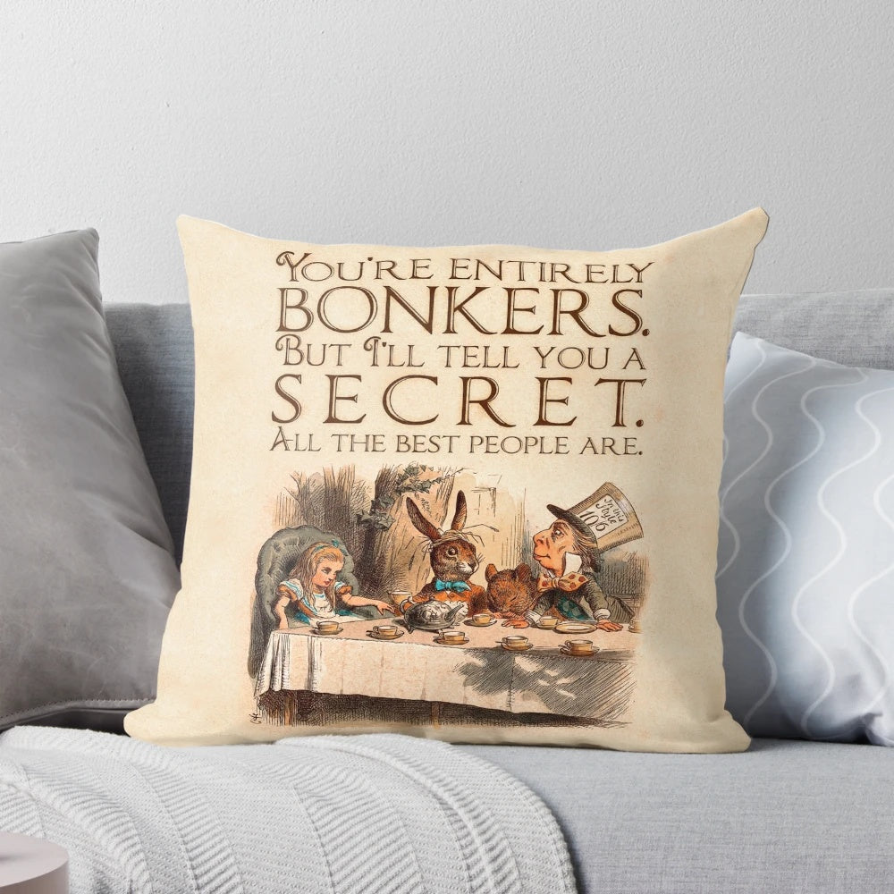 Decorative throw pillow featuring a quote from Alice in Wonderland's Mad Hatter