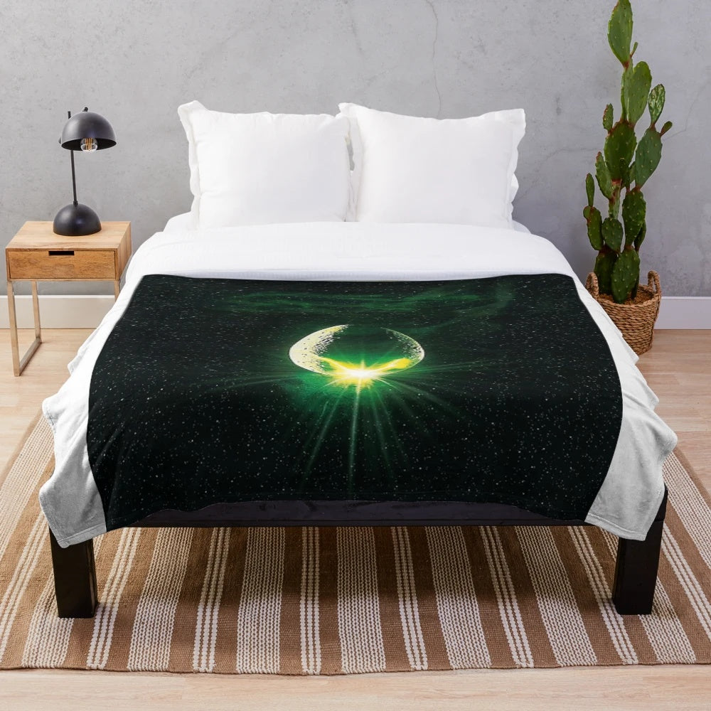 Plush alien-themed blanket in a retro, nostalgic style