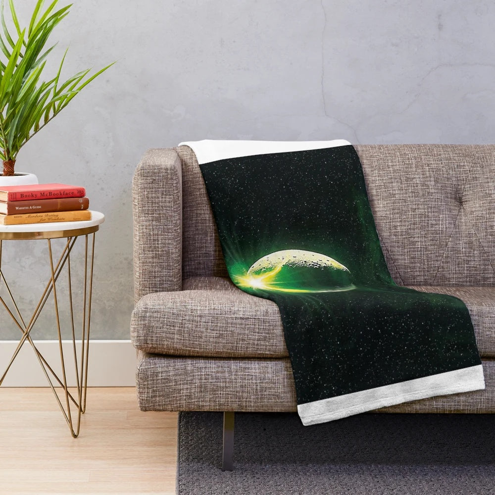 Plush alien-themed blanket in a retro, nostalgic style