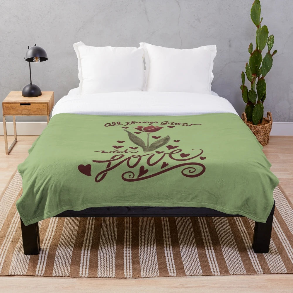 Soft, floral plush blanket with "All Things Grow with Love" design