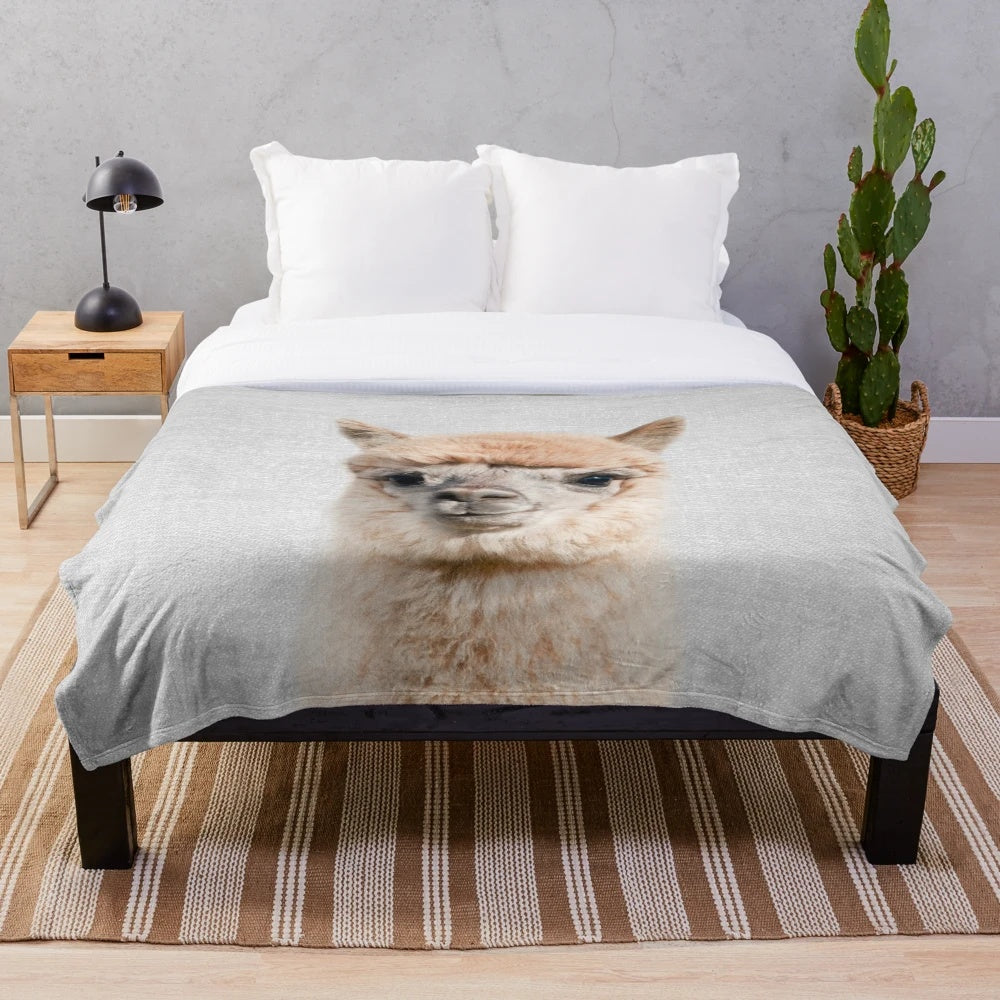 Colorful alpaca-themed plush blanket for nursery or home