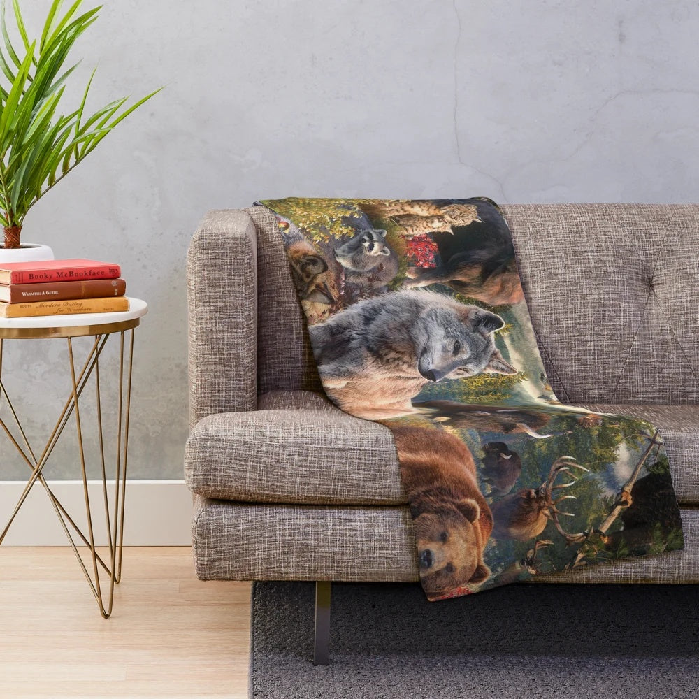 Plush blanket featuring various American wildlife animals like wolves, bears, eagles, and more