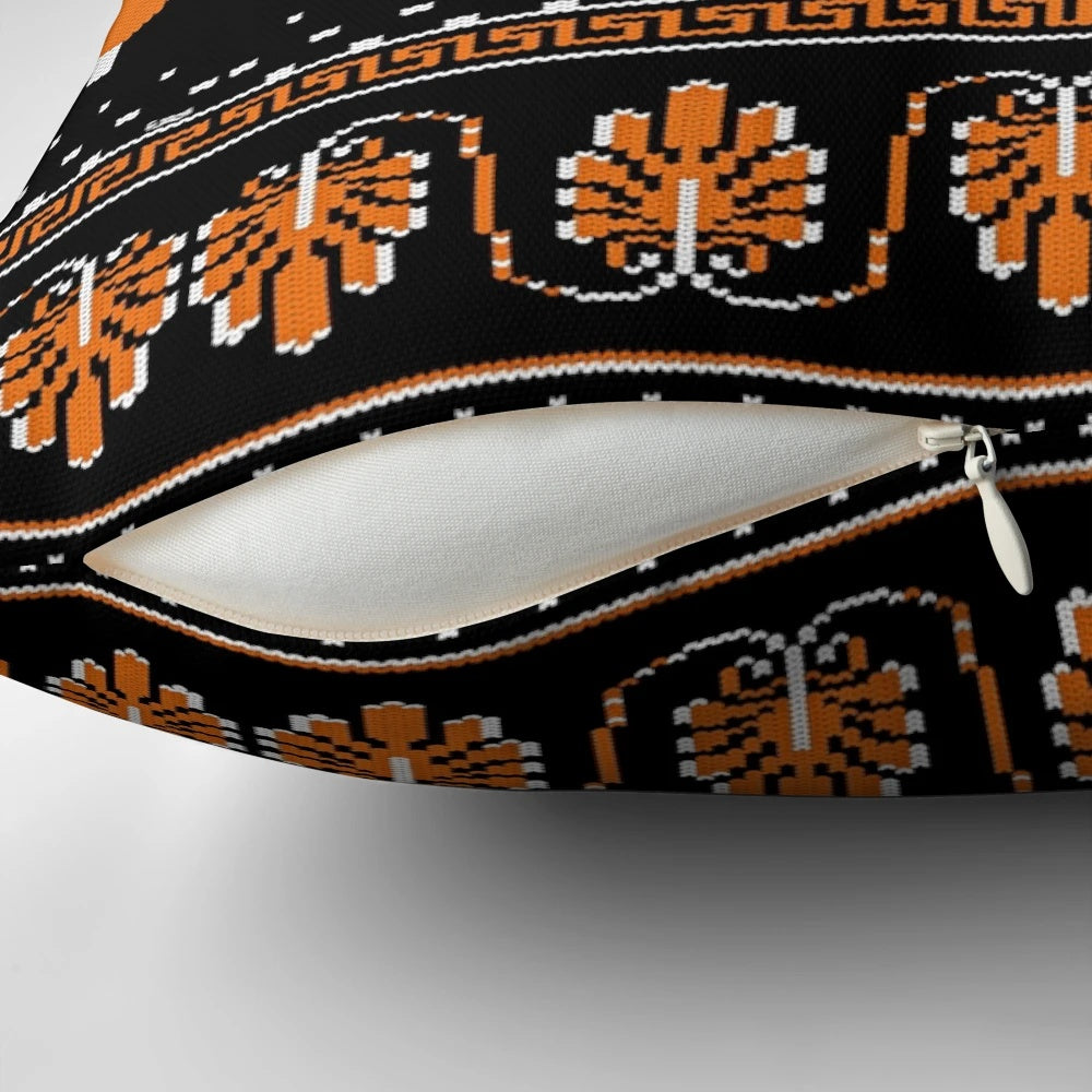 Decorative ancient Greek-inspired knit pillow with intricate patterns