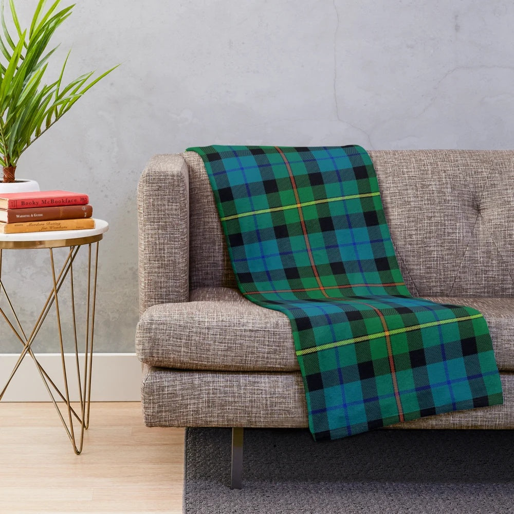 Plush blanket featuring the ancient tartan and rampant lion design
