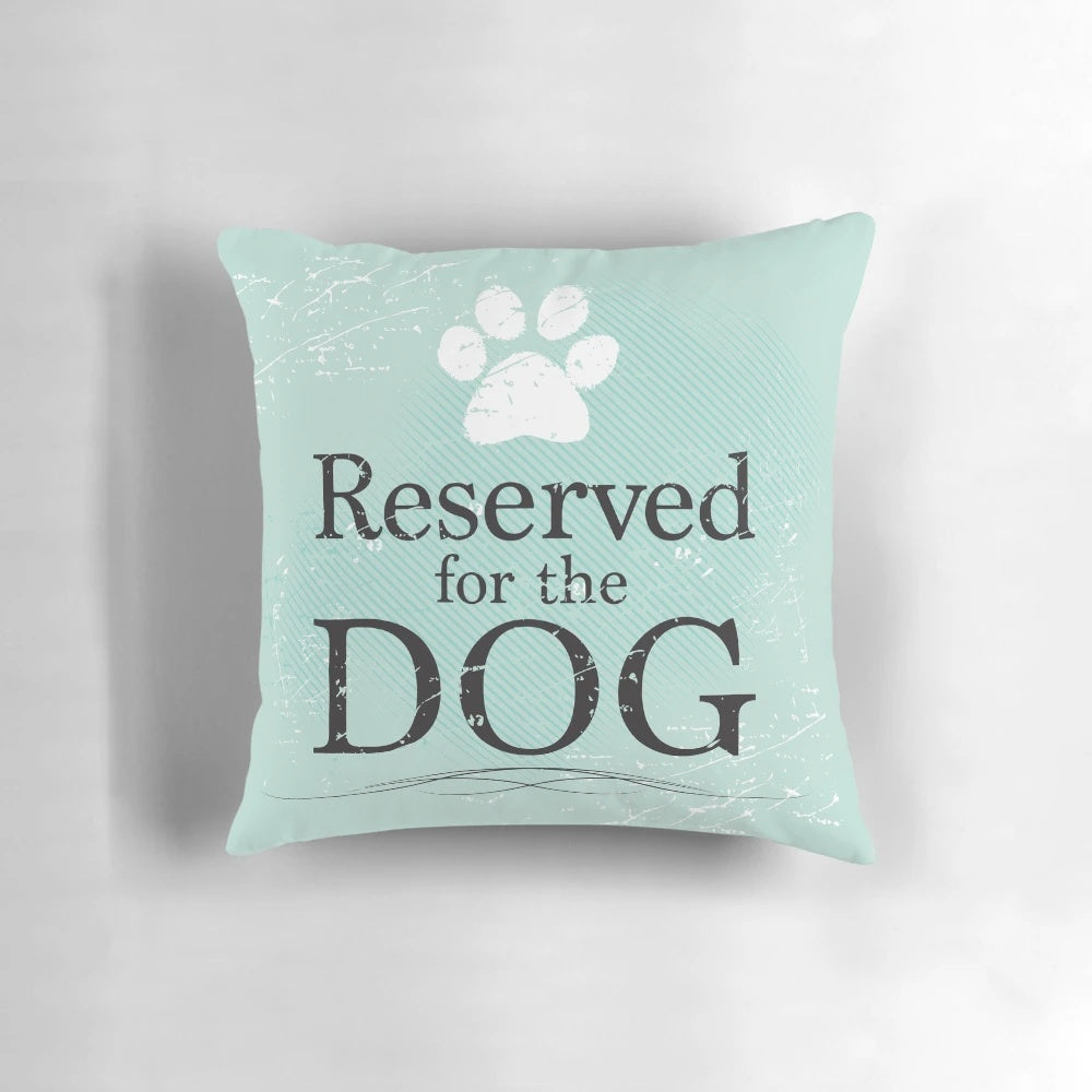 A soft, plush dog pillow in teal, blue, and green colors, perfect for a dog to sleep and relax on.