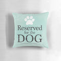A soft, plush dog pillow in teal, blue, and green colors, perfect for a dog to sleep and relax on.