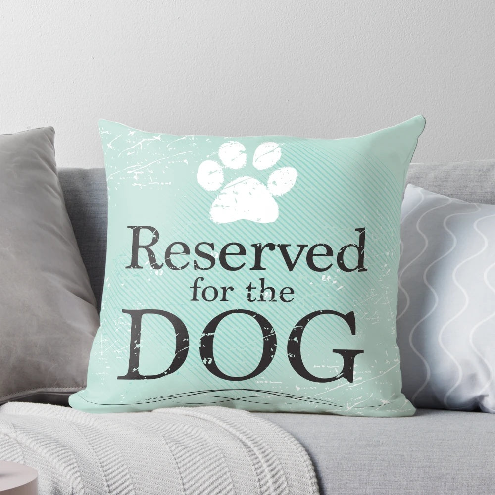 A soft, plush dog pillow in teal, blue, and green colors, perfect for a dog to sleep and relax on.