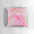 A plush and decorative pink brushed pillow with a preppy, trendy design.