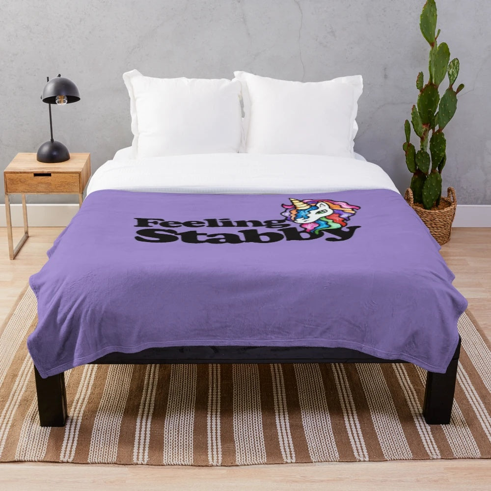 Cozy and soft "Feeling Stabby" plush blanket with rainbow unicorn design