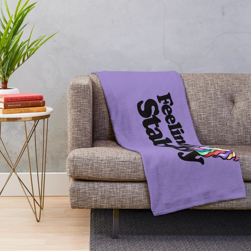 Cozy and soft "Feeling Stabby" plush blanket with rainbow unicorn design