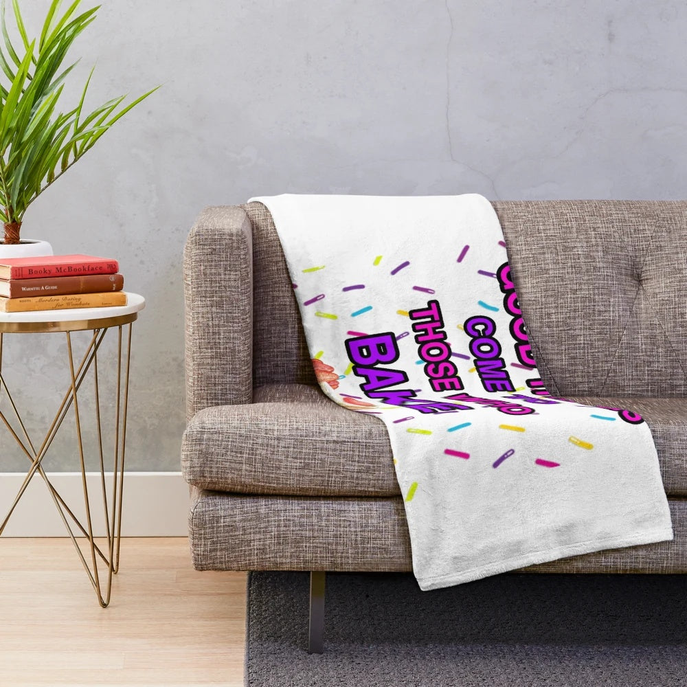 A soft and plush blanket in a neutral color, ideal for snuggling up on the couch or bed.