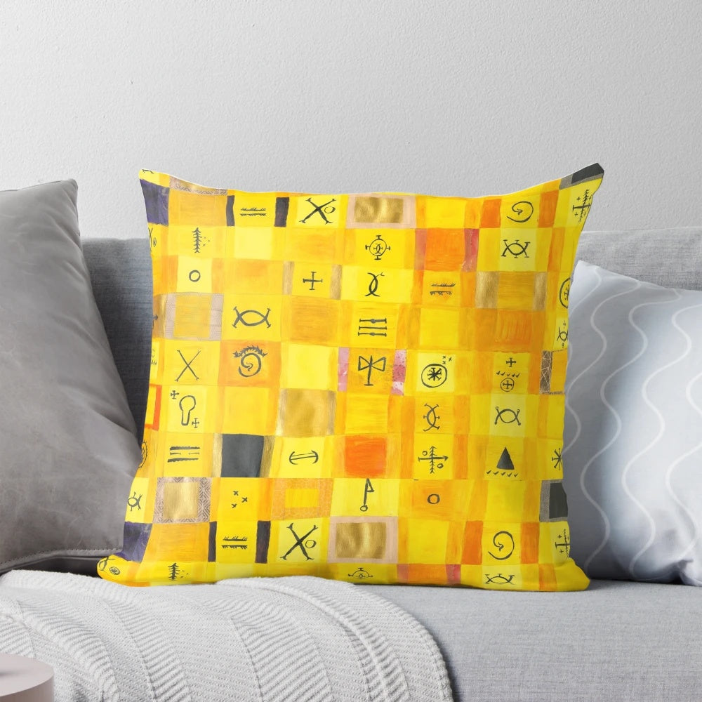 Soft, yellow love-themed pillow with heart-shaped symbols and glyphs