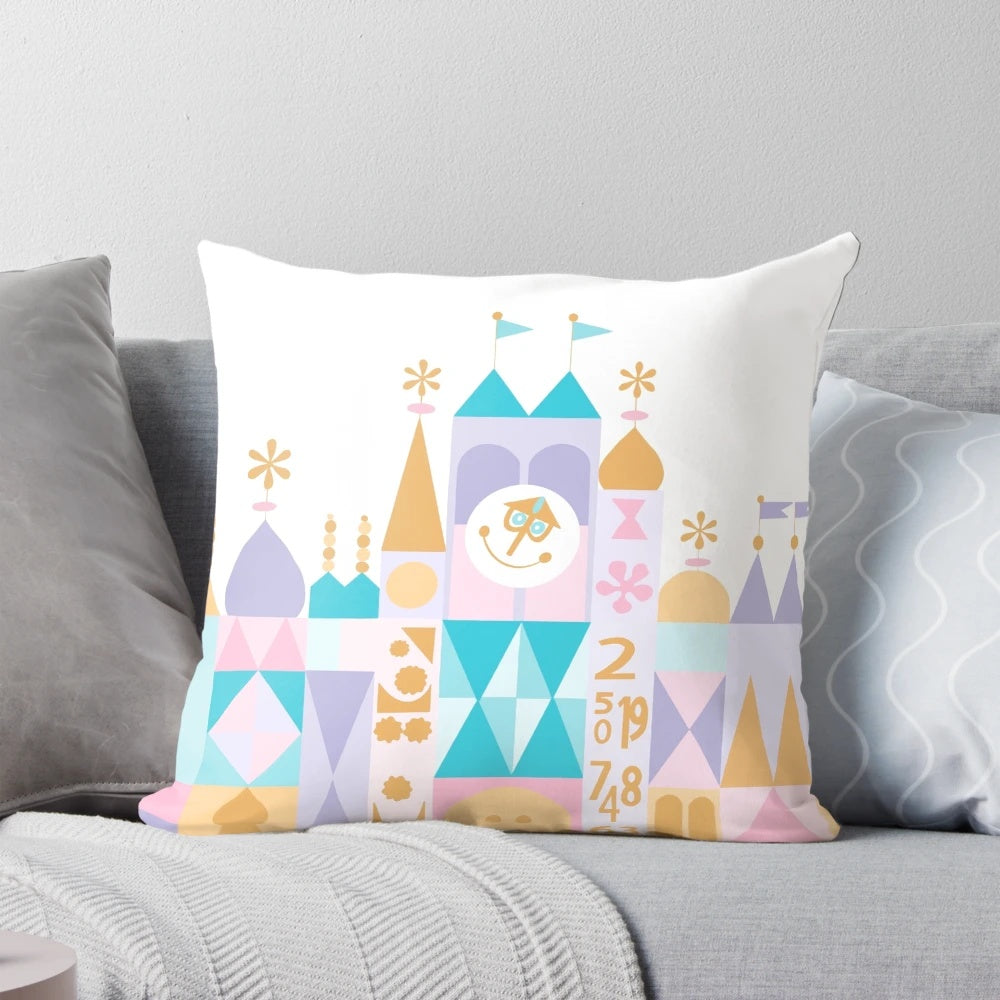 A plush, decorative pillow featuring a miniature, fantasy-inspired "small world" design.