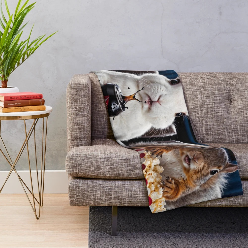 Plush blanket with cute animals watching horror movies and eating popcorn