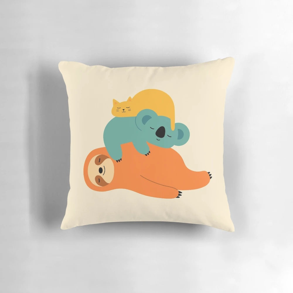 Plush pillow in the shape of a sleeping animal, featuring a soft and comfy design.