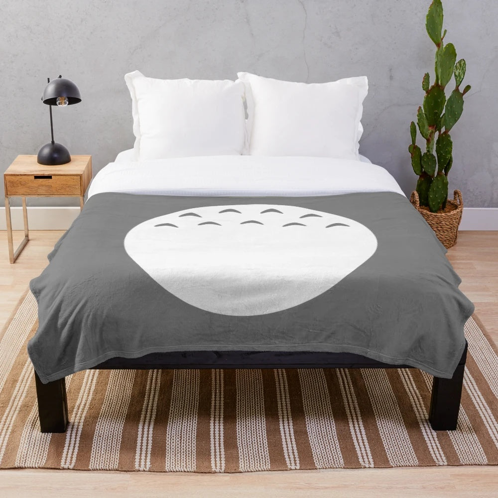 Soft and fluffy plush blanket with a forest spirit design