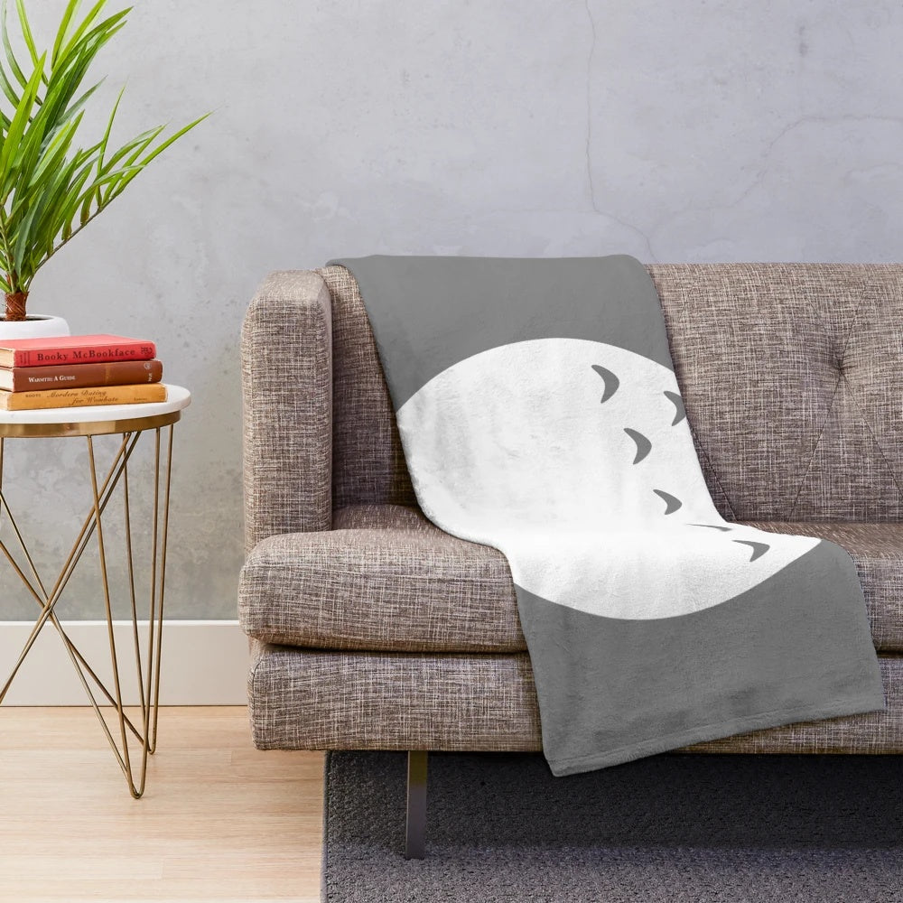 Soft and fluffy plush blanket with a forest spirit design