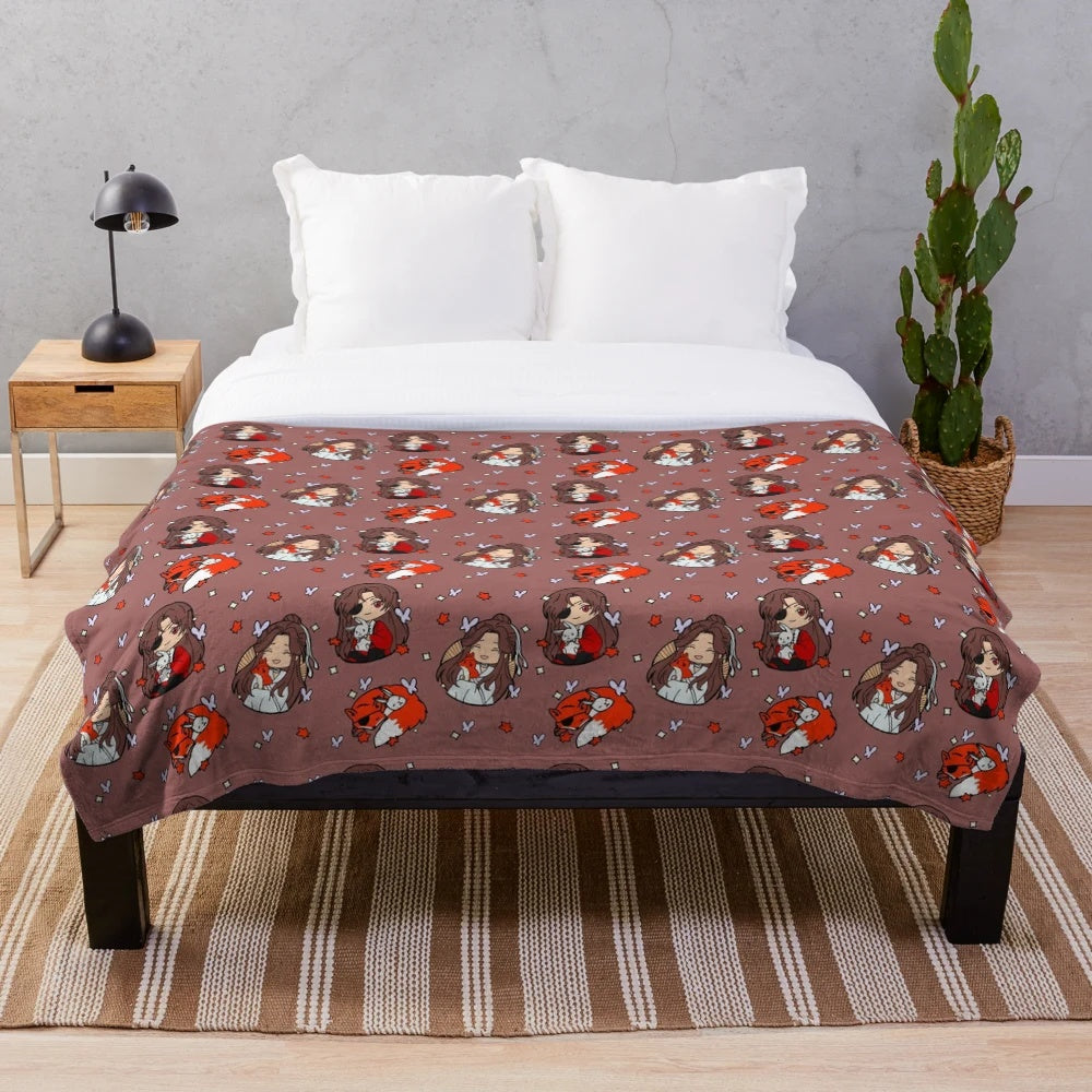 Cozy anime-inspired TGCF plush blanket featuring chibi characters, foxes, and kitsunes