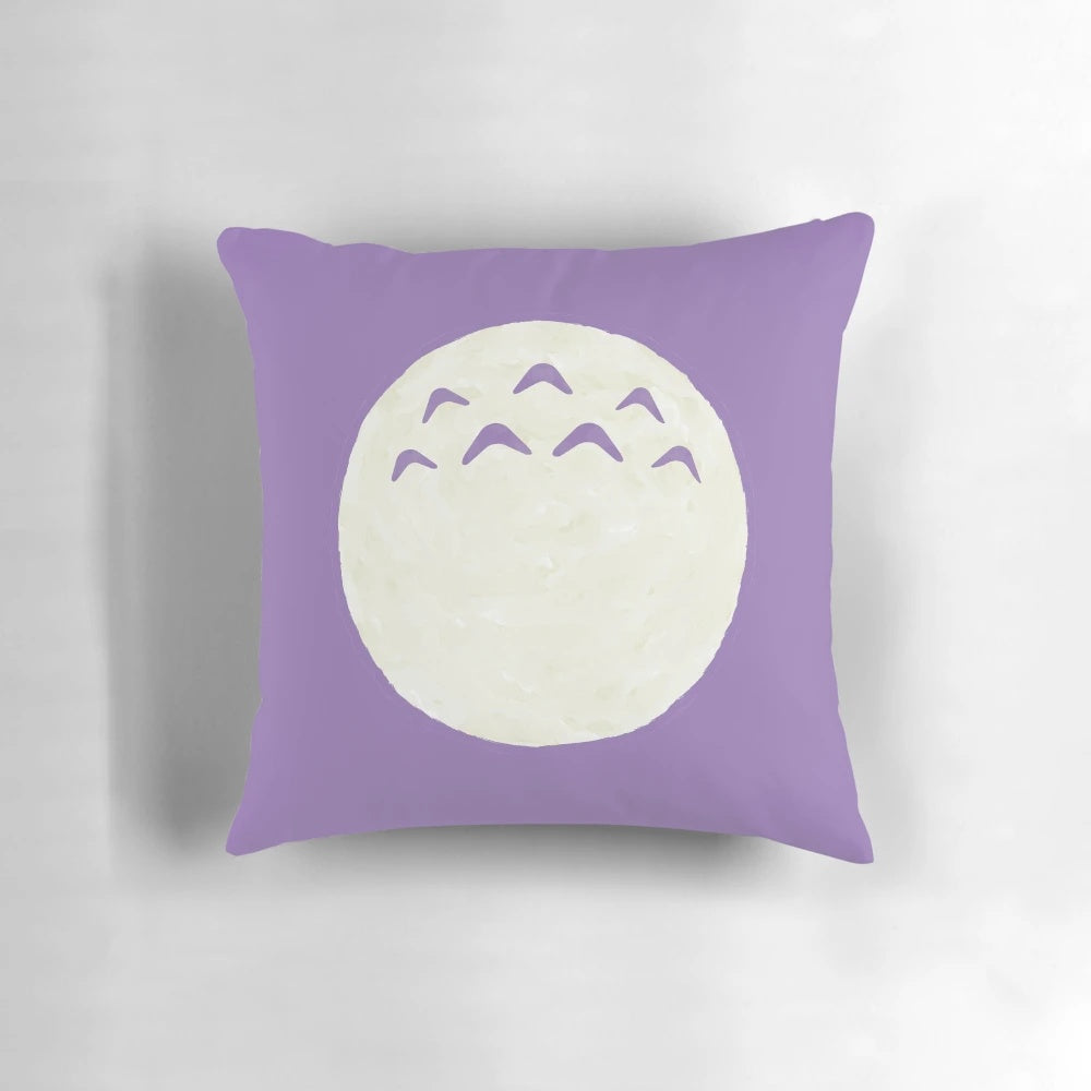 A soft, plush pillow featuring the beloved characters from the Studio Ghibli film "My Neighbor Totoro".