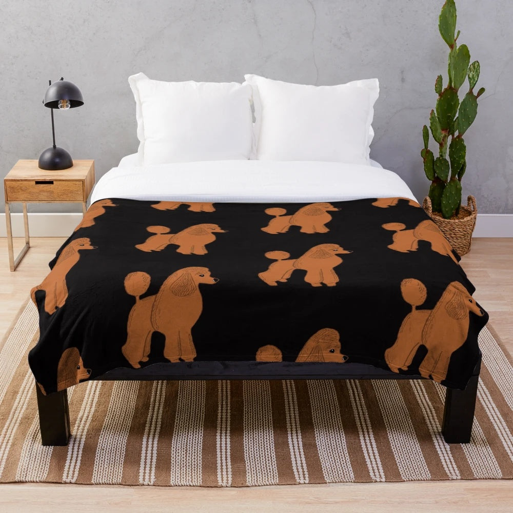 Apricot poodle on a black plush blanket