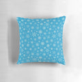 Aqua blue pillow with delicate white snowflakes, perfect for Christmas and winter home decor