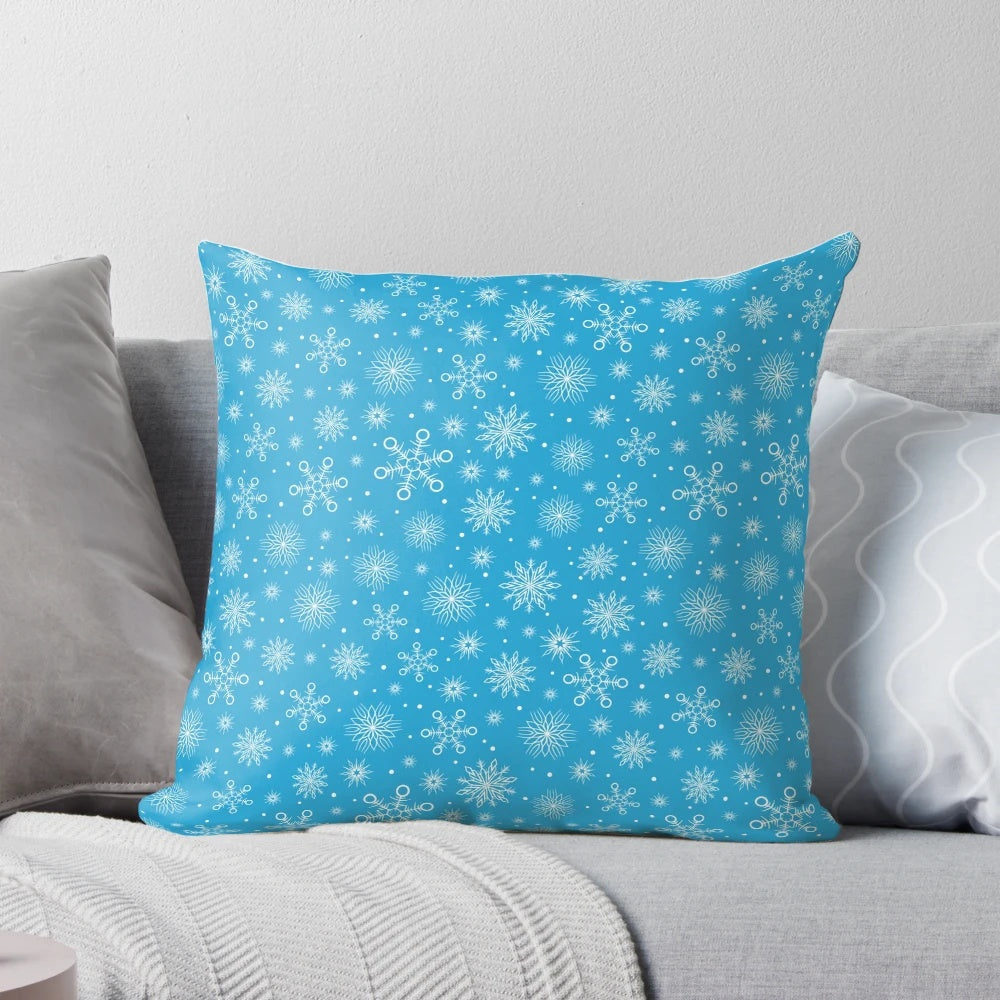 Aqua blue pillow with delicate white snowflakes, perfect for Christmas and winter home decor