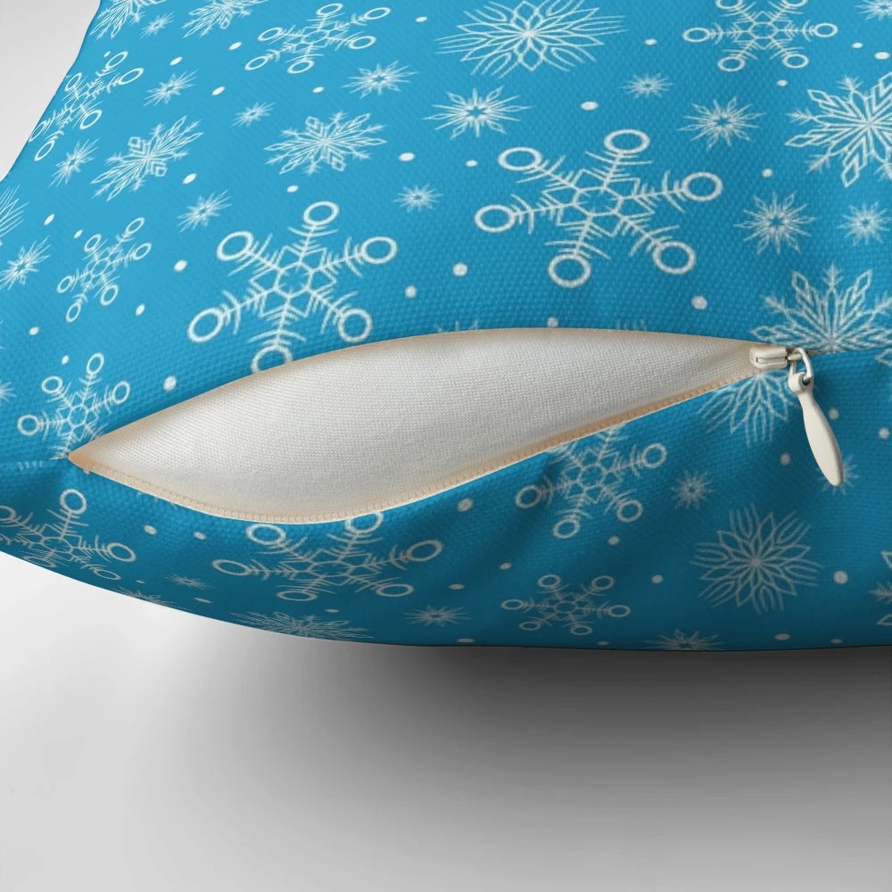 Aqua blue pillow with delicate white snowflakes, perfect for Christmas and winter home decor