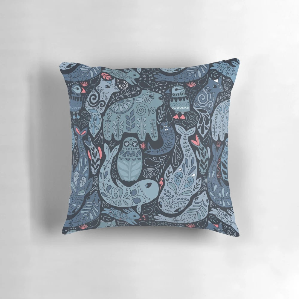 Soft, plush pillow featuring a collage of arctic animals including a narwhal, polar bear, whale, puffin, owl, fox, bunny, and seal.