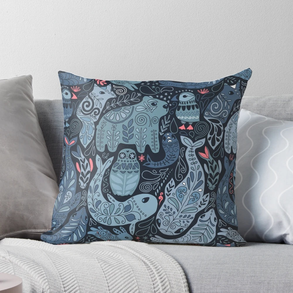 Soft, plush pillow featuring a collage of arctic animals including a narwhal, polar bear, whale, puffin, owl, fox, bunny, and seal.