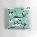 A decorative throw pillow featuring illustrations of whales, penguins, and other arctic animals.