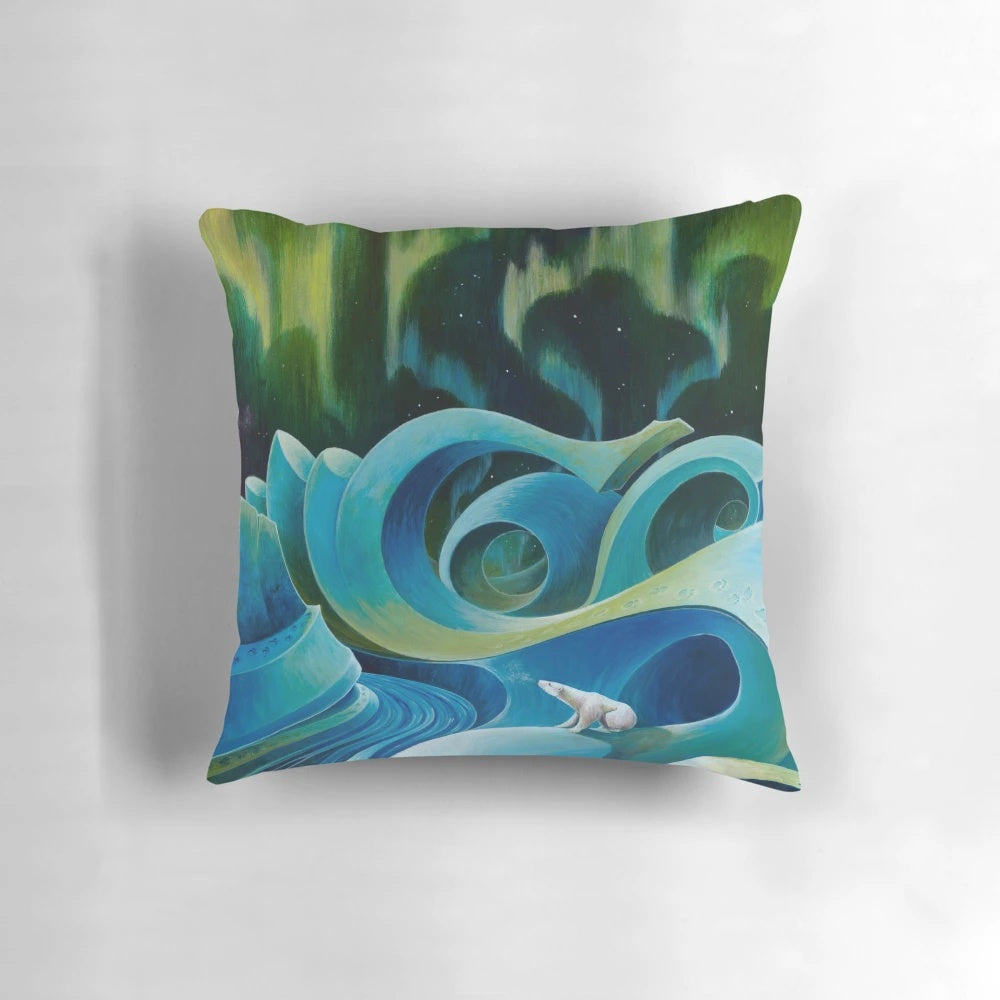 Fluffy white and blue pillow with a detailed design of a polar bear against an arctic landscape