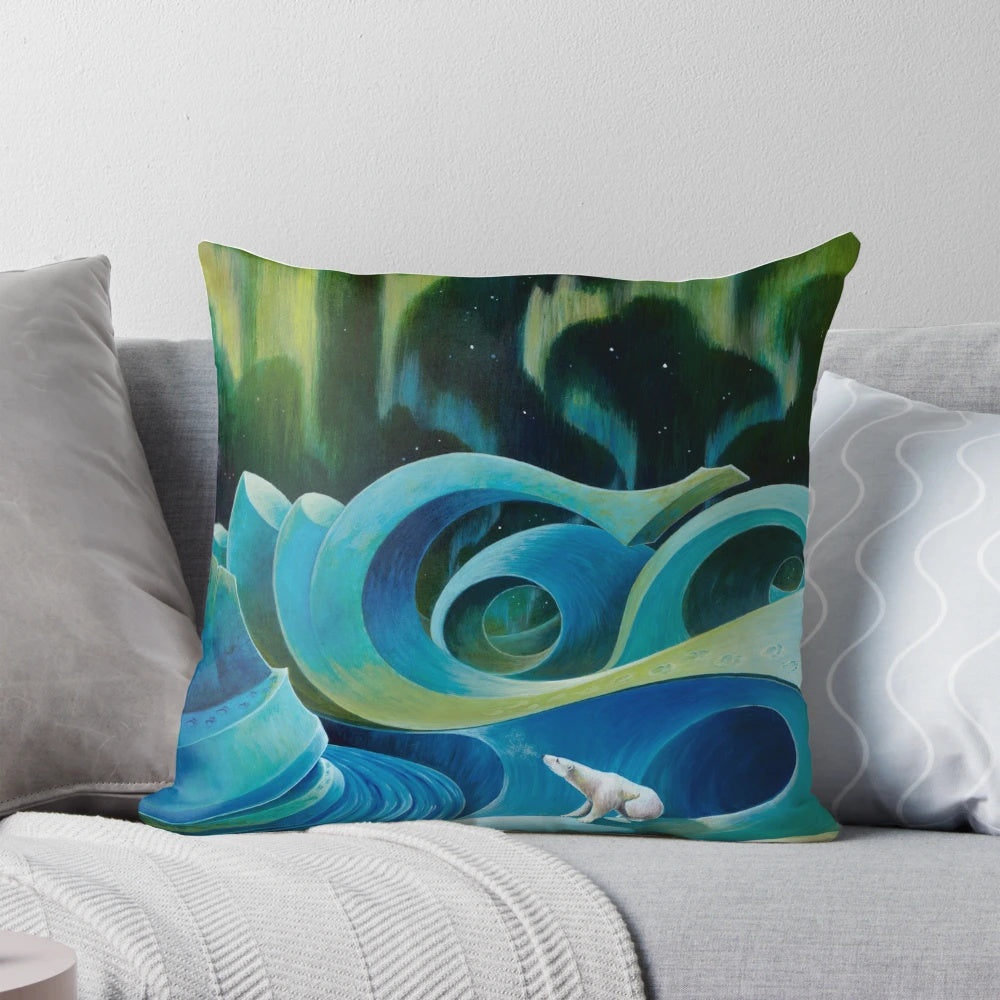 Fluffy white and blue pillow with a detailed design of a polar bear against an arctic landscape