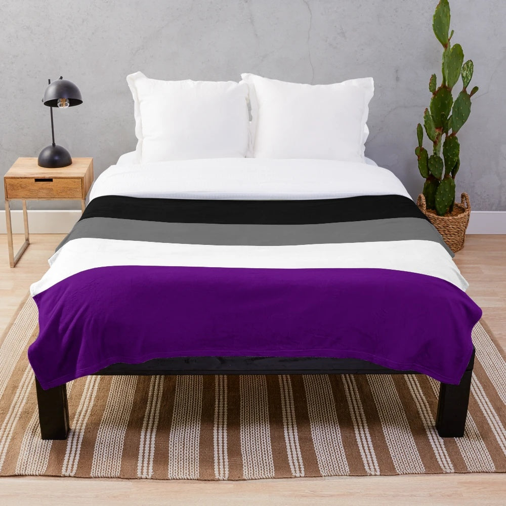 Plush blanket with seamless repeating asexual pride flag pattern