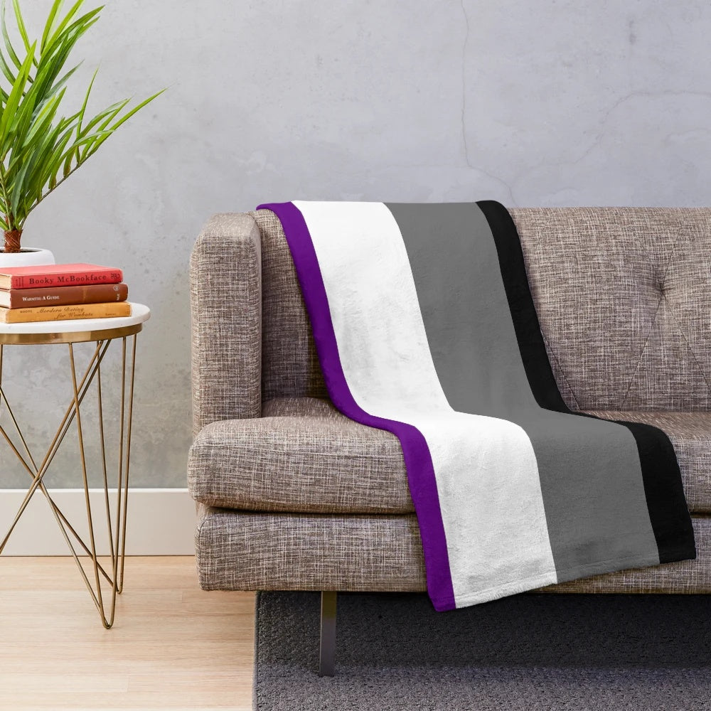 Plush blanket with seamless repeating asexual pride flag pattern