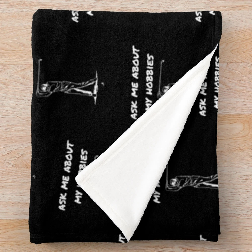 Soft and cozy plush blanket with "Ask About My Hobbies" design