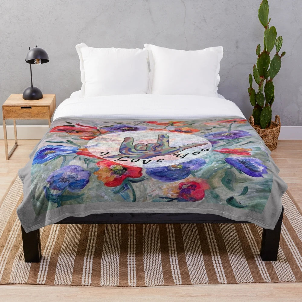 Soft and warm plush blanket with ASL "I Love You" sign and floral designs