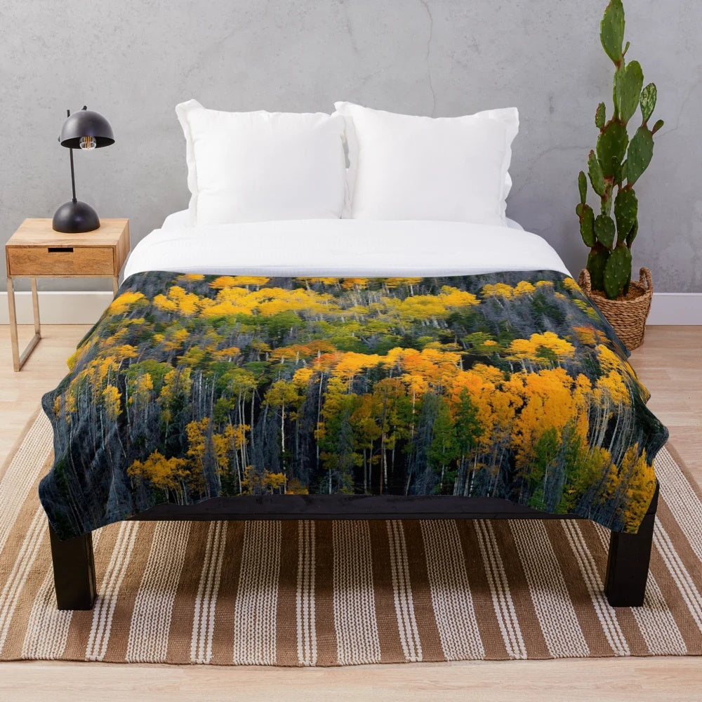Plush blanket with vibrant aspen trees in fall landscape