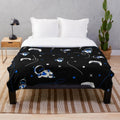 Soft and cuddly plush blanket featuring an Astrobot-inspired pattern, perfect for PlayStation 5 fans.