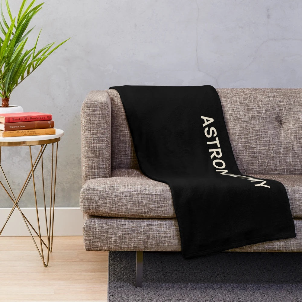 Astronomy-themed plush blanket with stars, planets, and galaxies