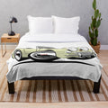 Soft white plush blanket with an illustration of the classic Austin Healey Sprite sports car