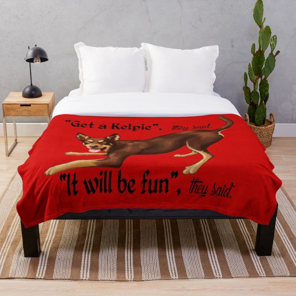 Australian Kelpie dog breed on a soft, plush blanket