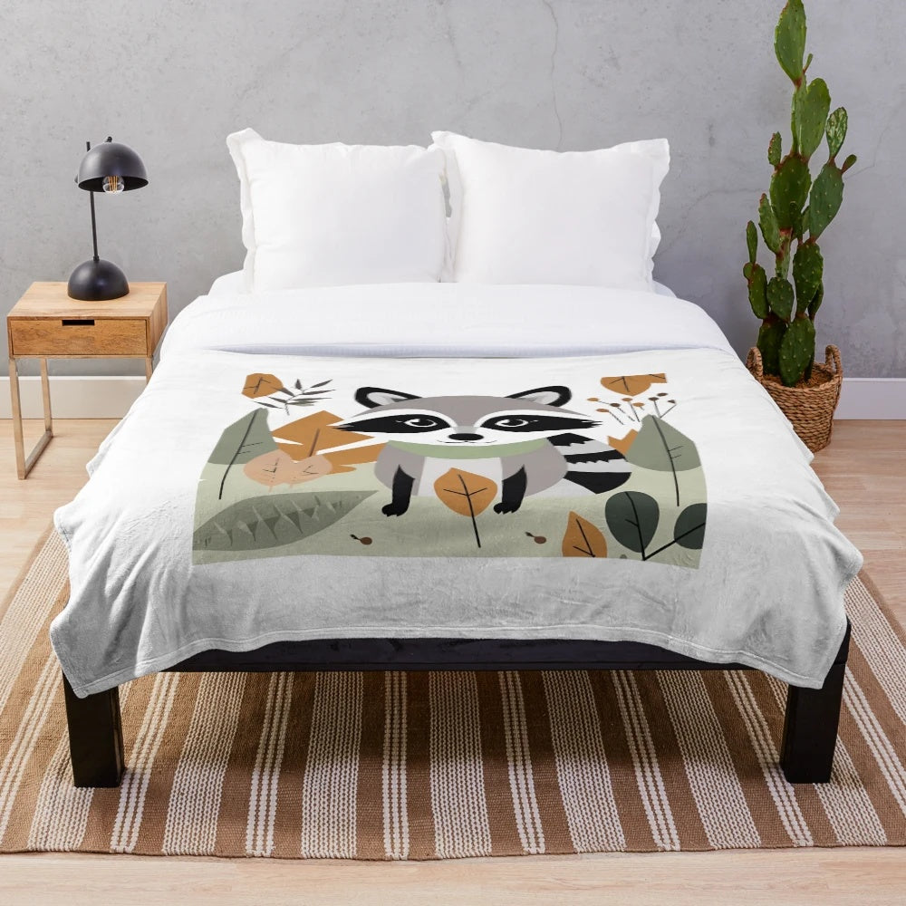 Plush blanket featuring a cute raccoon and autumn foliage design
