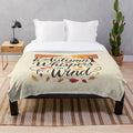 Autumn-inspired plush blanket with colorful leaf design