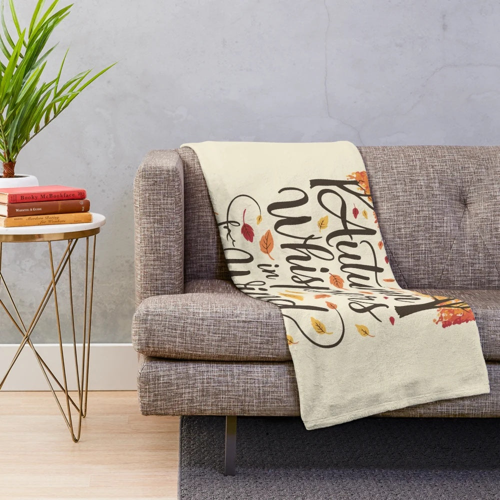 Autumn-inspired plush blanket with colorful leaf design
