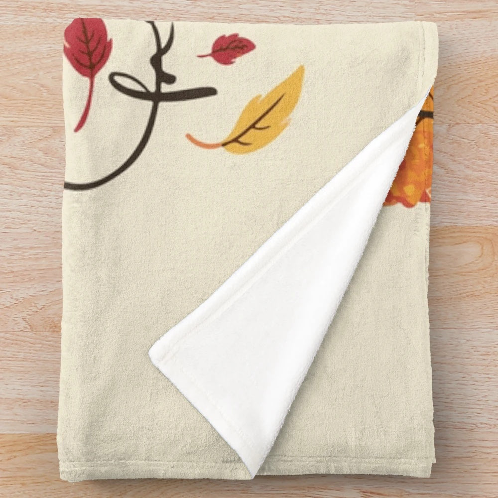Autumn-inspired plush blanket with colorful leaf design