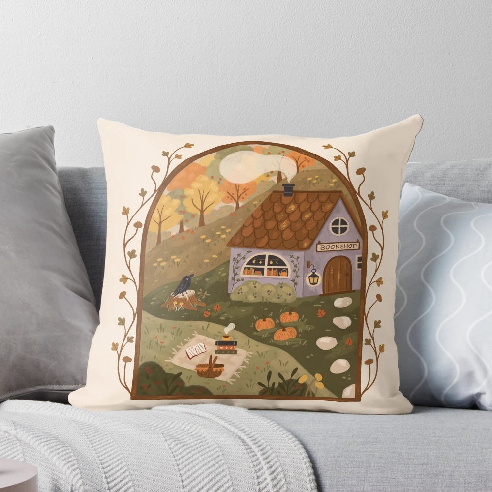 Autumn-themed throw pillow with books, pumpkins, and a cozy cottage design