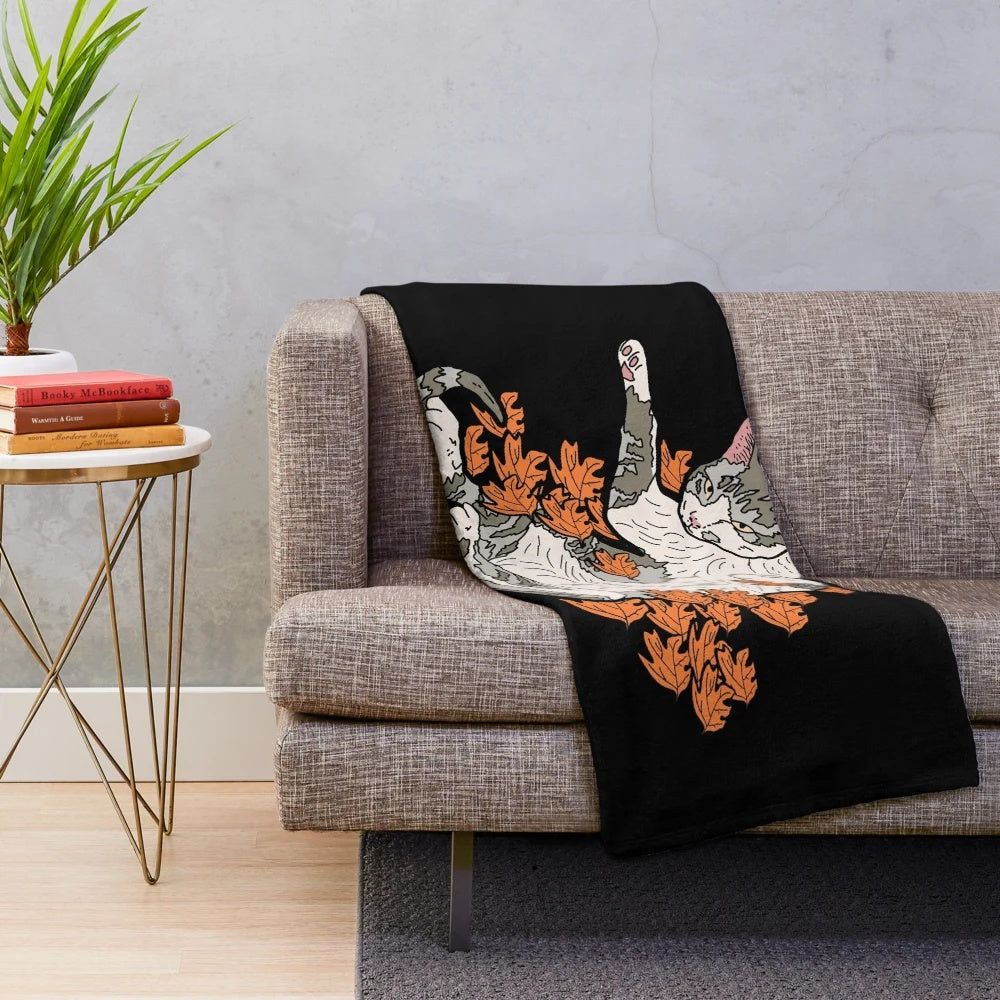 Cozy autumn cat plush blanket with sleeping cat design